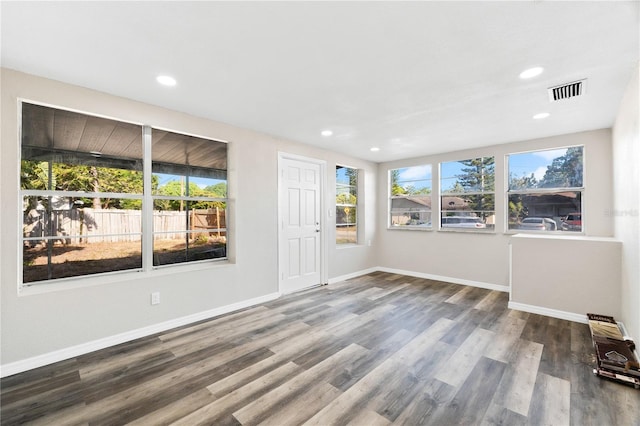 spare room with hardwood / wood-style floors