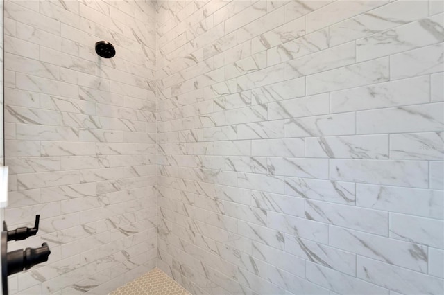 bathroom with tiled shower