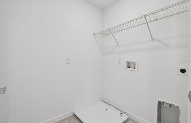 laundry room featuring hookup for a washing machine, light tile patterned floors, and hookup for an electric dryer