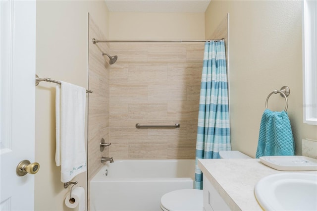 full bathroom featuring vanity, toilet, shower / bath combo with shower curtain, and a textured ceiling