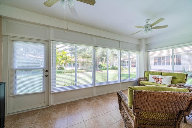 sunroom featuring ceiling fan