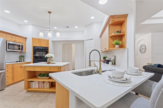 kitchen featuring a kitchen island, black appliances, backsplash, pendant lighting, and light tile flooring