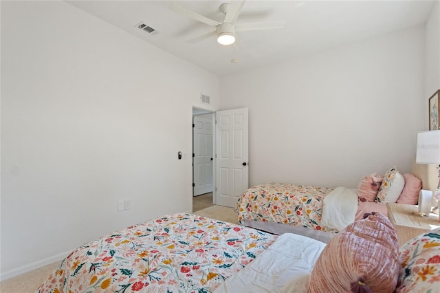 bedroom with ceiling fan and light colored carpet