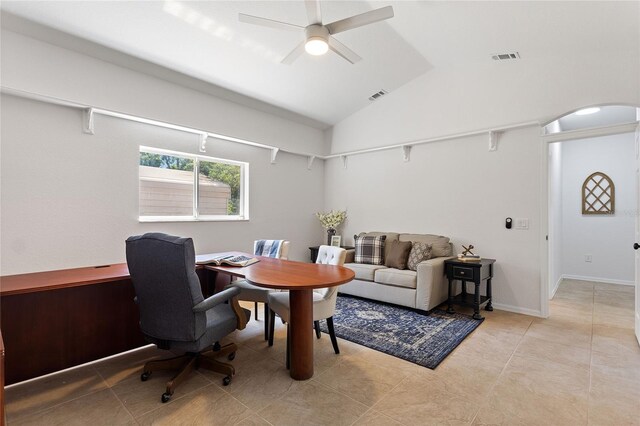 home office with lofted ceiling, light tile flooring, and ceiling fan