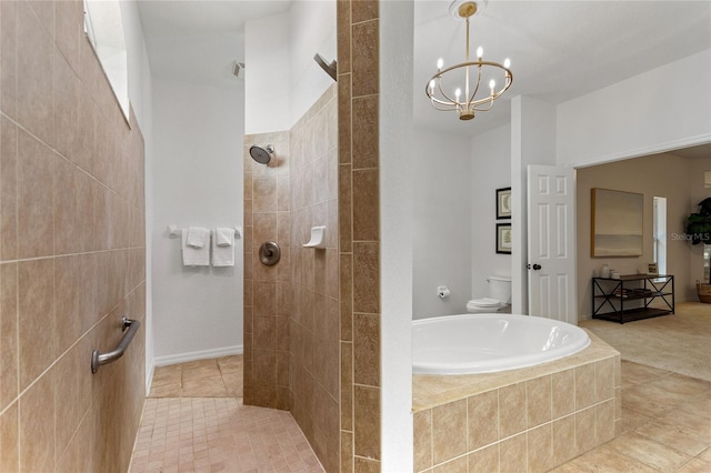 bathroom featuring a relaxing tiled bath, tile flooring, a notable chandelier, and toilet