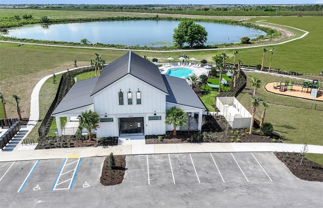 birds eye view of property with a water view