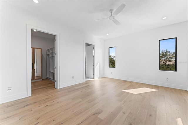 unfurnished bedroom featuring recessed lighting, baseboards, light wood-style floors, and a ceiling fan