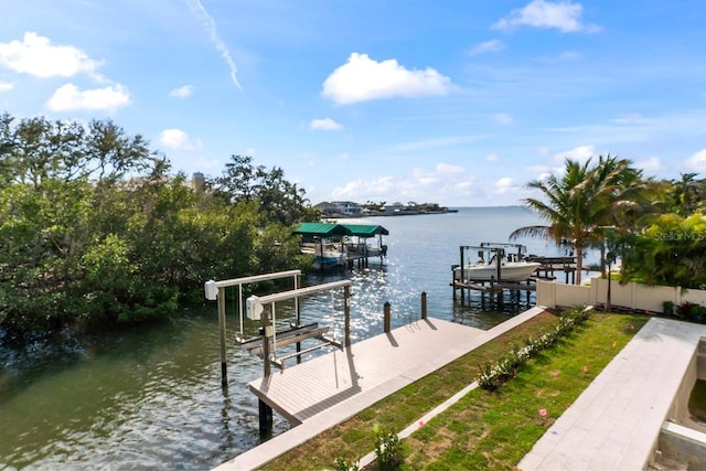 dock area with a water view and boat lift