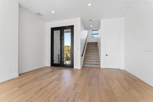 entrance foyer featuring light wood-type flooring, stairway, visible vents, and recessed lighting