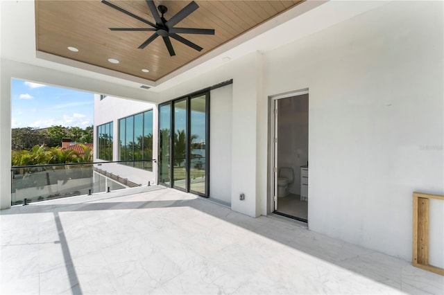 view of patio featuring a balcony and a ceiling fan