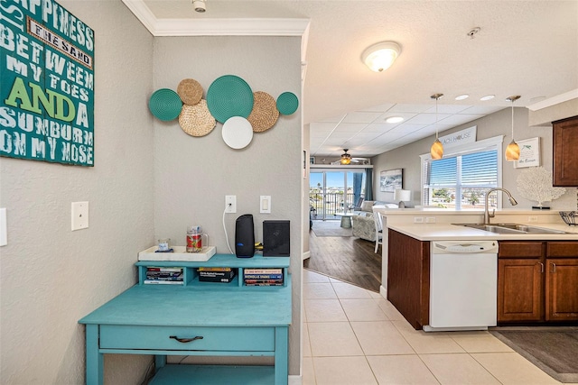 kitchen with light wood-type flooring, ornamental molding, ceiling fan, and white dishwasher