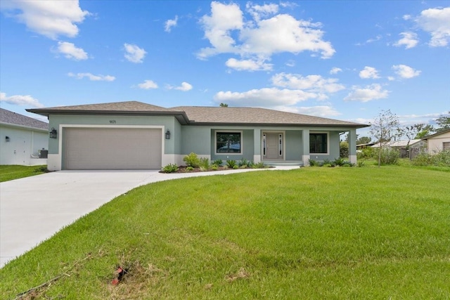 single story home featuring a garage and a front lawn