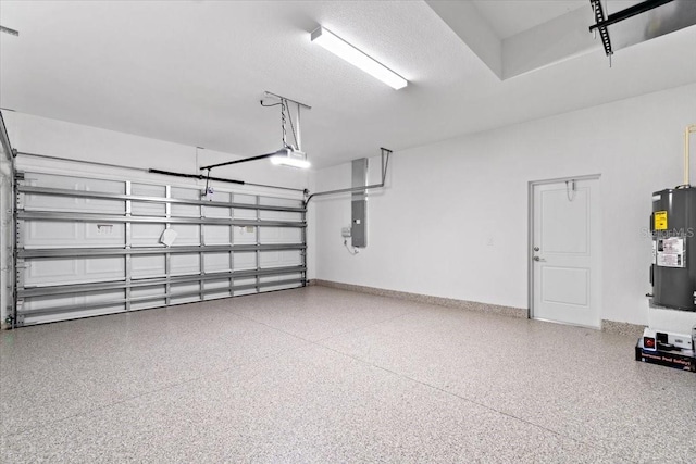 garage featuring a garage door opener, electric panel, and electric water heater