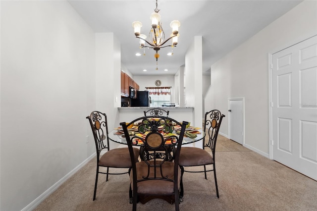 8545 Trail Wind Dr, Tampa, FL 33647 - dining room with light carpet and a notable chandelier