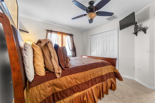 8545 Trail Wind Dr, Tampa, FL 33647 - bedroom with light carpet, a closet, and ceiling fan