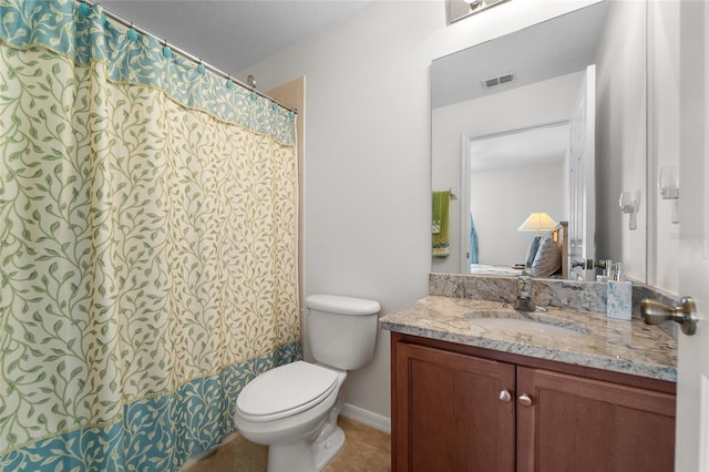 8545 Trail Wind Dr, Tampa, FL 33647 - bathroom featuring vanity, a textured ceiling, and toilet