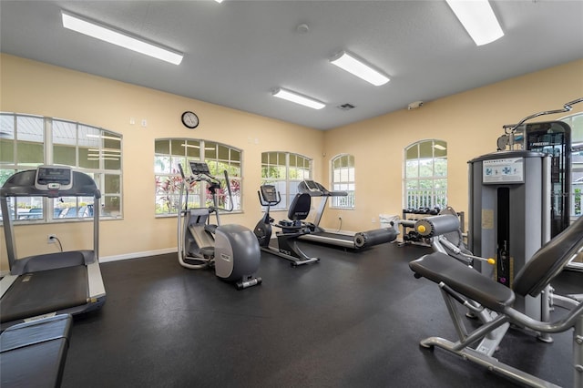 8545 Trail Wind Dr, Tampa, FL 33647 - gym featuring a textured ceiling