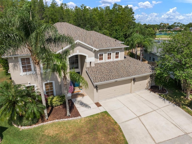 view of front of home featuring a front yard and a garage