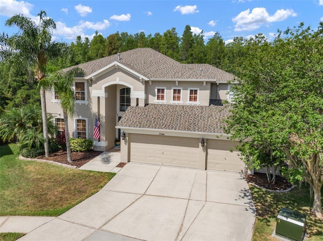 view of front facade featuring a garage and a front lawn