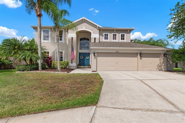 view of front facade featuring a garage and a front yard