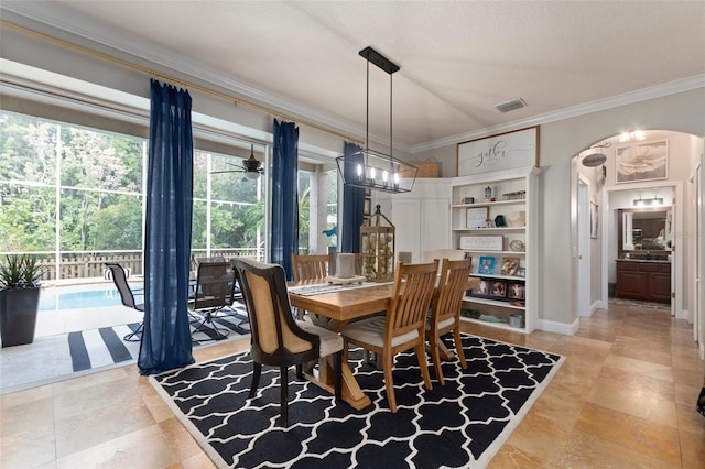 dining room featuring crown molding