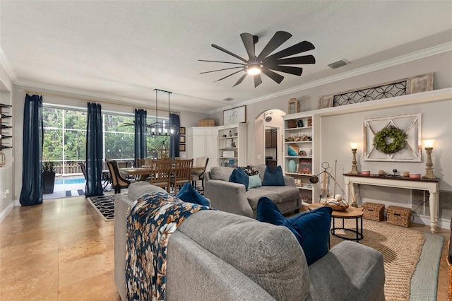 living room with ceiling fan, a textured ceiling, and ornamental molding