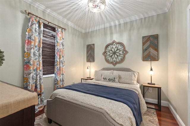 bedroom with hardwood / wood-style flooring and crown molding