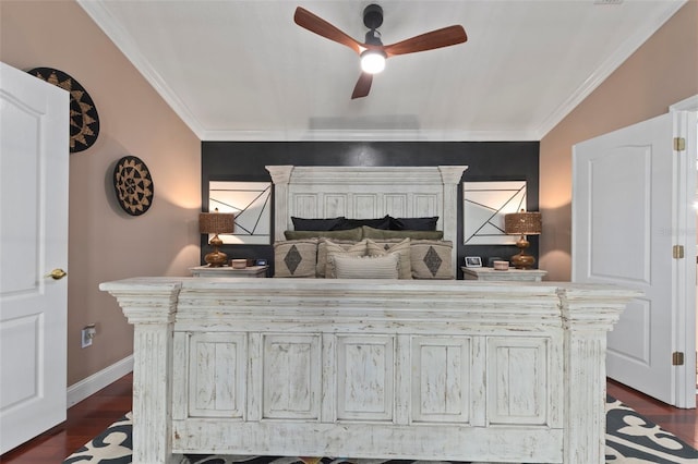 bedroom featuring ceiling fan, dark hardwood / wood-style flooring, ornamental molding, and multiple windows