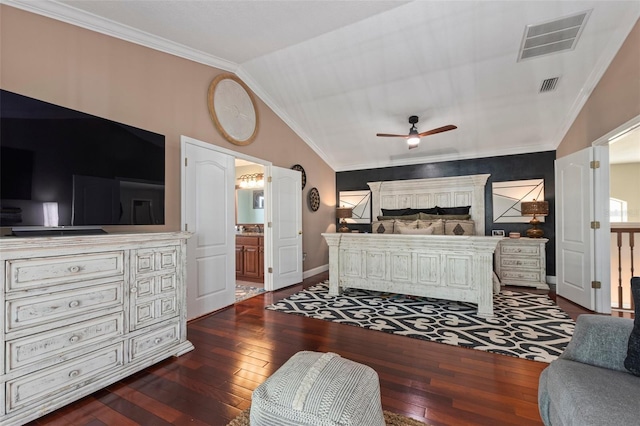 bedroom with crown molding, ensuite bath, vaulted ceiling, dark hardwood / wood-style floors, and ceiling fan