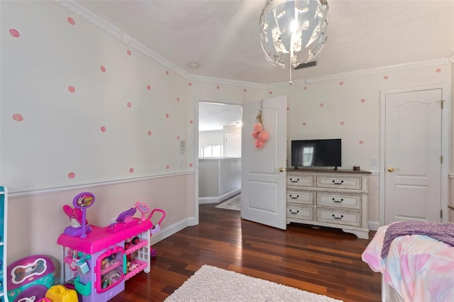 bedroom featuring crown molding and dark hardwood / wood-style floors