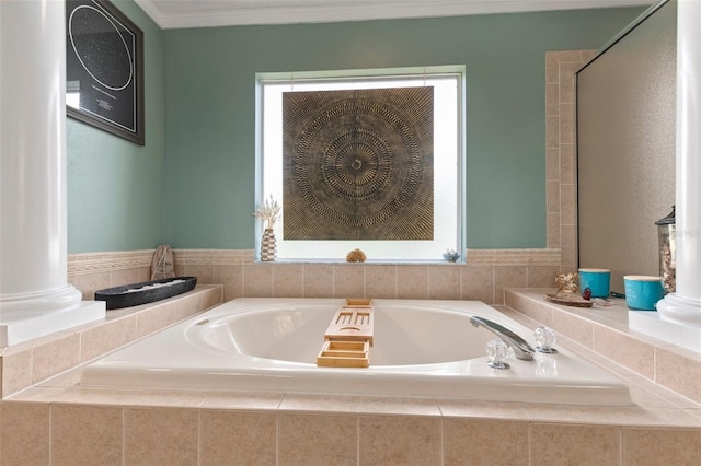 bathroom with crown molding and tiled tub