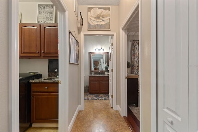 corridor featuring light tile patterned floors