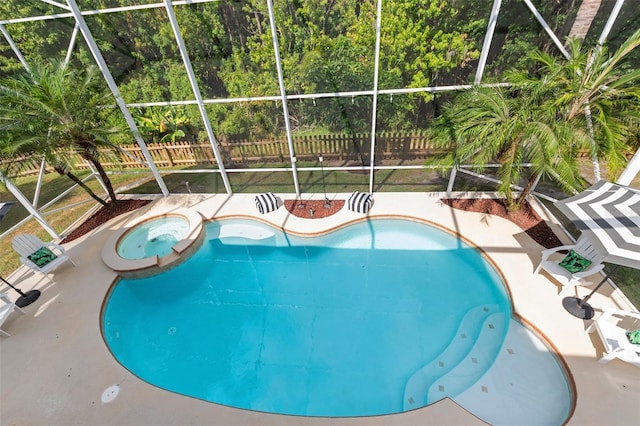 view of pool featuring an in ground hot tub, a patio, and glass enclosure