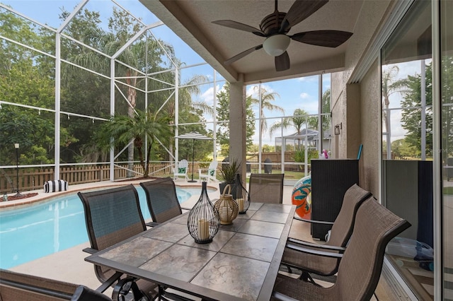 exterior space with a lanai, a patio area, and ceiling fan