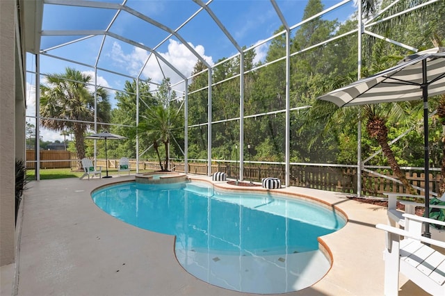 view of pool with a lanai, an in ground hot tub, and a patio