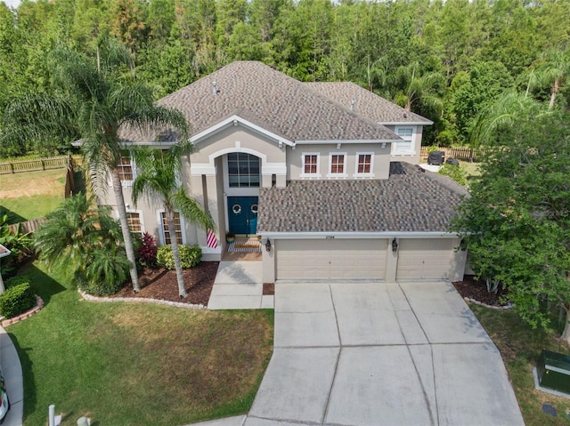 view of front of home featuring a garage and a front lawn