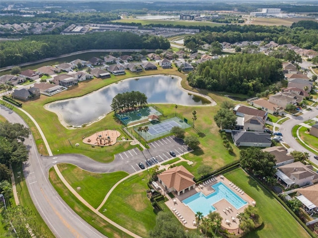 birds eye view of property with a water view