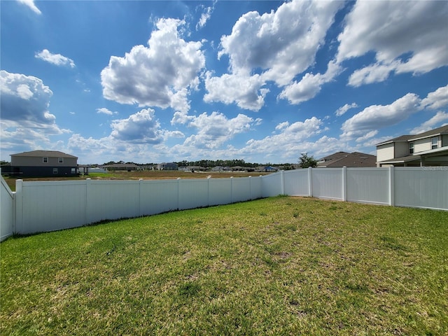 view of yard with a fenced backyard