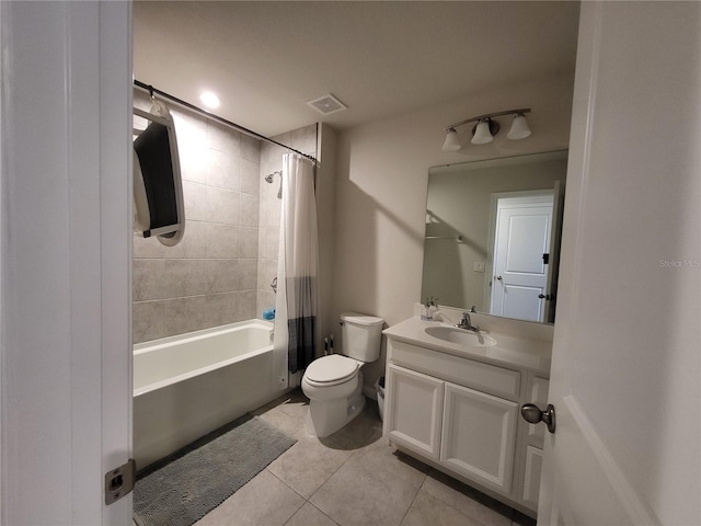 bathroom featuring visible vents, toilet, tile patterned flooring, shower / bath combination with curtain, and vanity