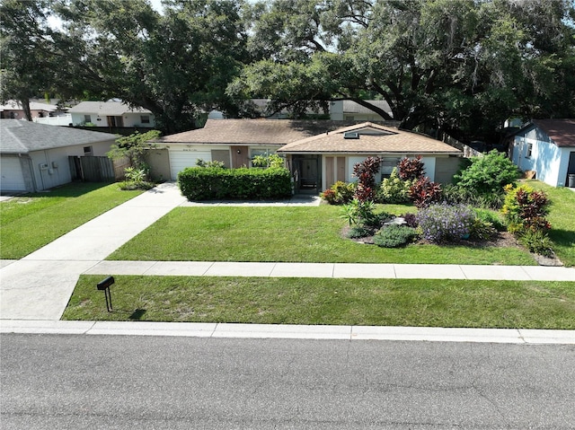 view of front facade with a front yard and fence