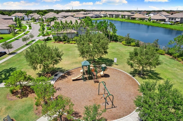 birds eye view of property featuring a water view