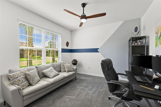 office space featuring ceiling fan and dark carpet