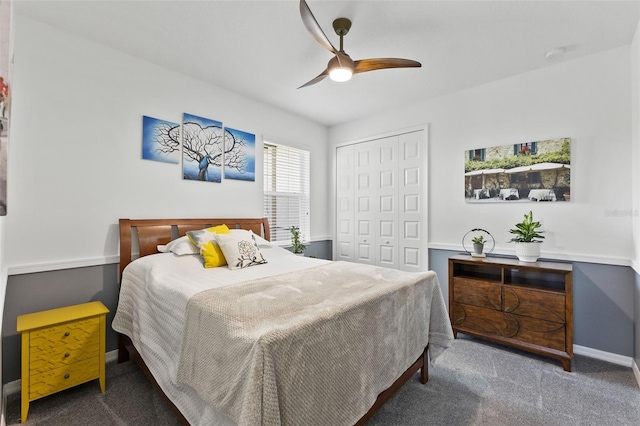 carpeted bedroom with ceiling fan and a closet