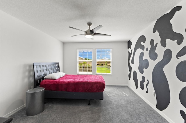 bedroom with a textured ceiling, ceiling fan, and carpet flooring