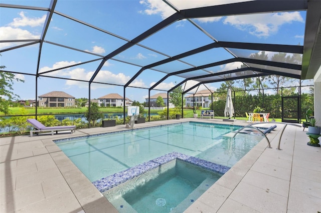 view of pool featuring a patio area, glass enclosure, a water view, and an in ground hot tub