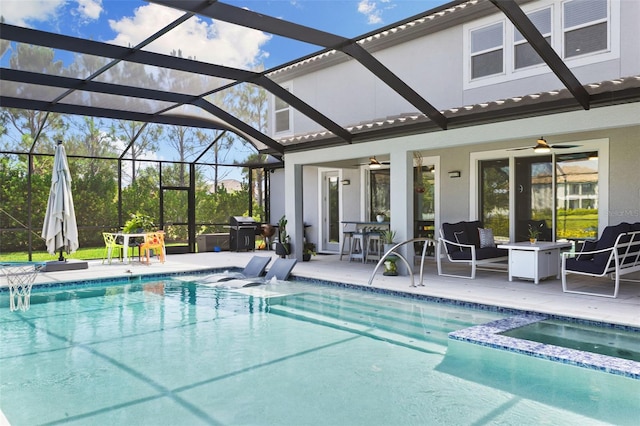 view of pool featuring ceiling fan, a grill, glass enclosure, and a patio