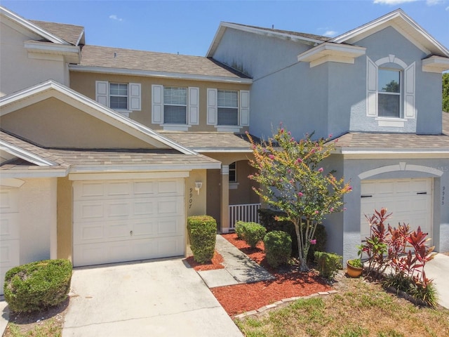 townhome / multi-family property featuring a garage