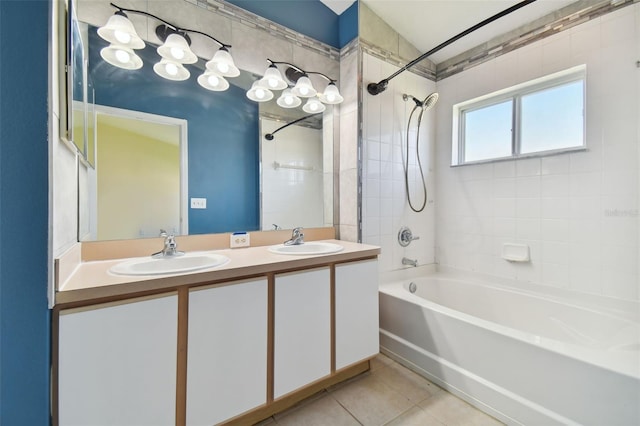 bathroom featuring tile flooring, oversized vanity, dual sinks, and tiled shower / bath combo