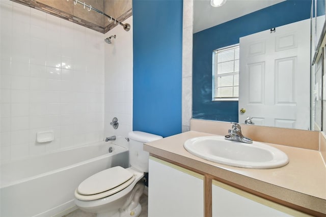 full bathroom featuring vanity, toilet, and tiled shower / bath combo