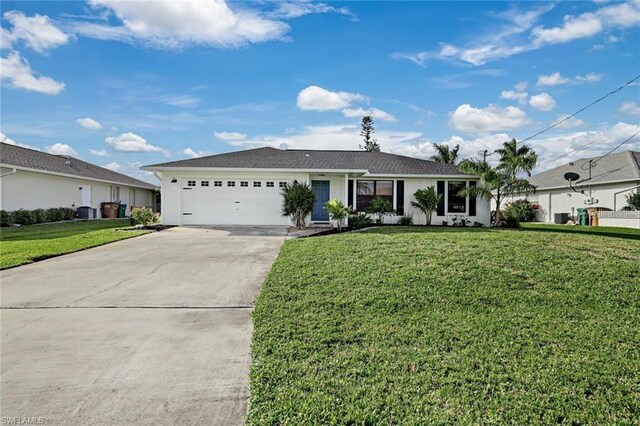 ranch-style house with a garage and a front lawn